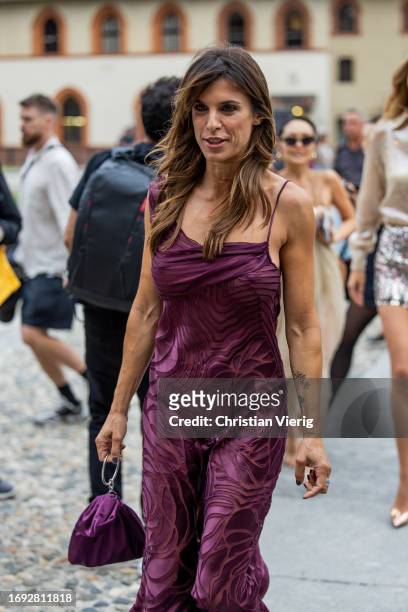 Italian actress Elisabetta Canalis wears burgundy dress outside Alberta Ferretti during the Milan Fashion Week - Womenswear Spring/Summer 2024 on...