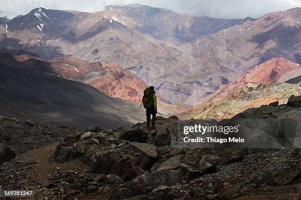 man walkin in the border of the aconcágua mount - mendoza argentina stock pictures, royalty-free photos & images