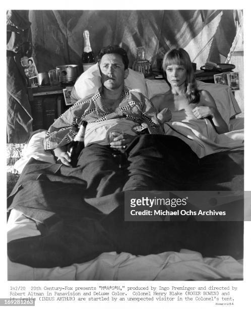 Roger Bowen and Indus Arthur are startled by unexpected visitor in their tent in a scene from the film 'MASH', 1970.