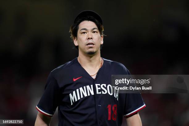 Kenta Maeda of the Minnesota Twins walks across the field in the fifth inning against the Cincinnati Reds at Great American Ball Park on September...