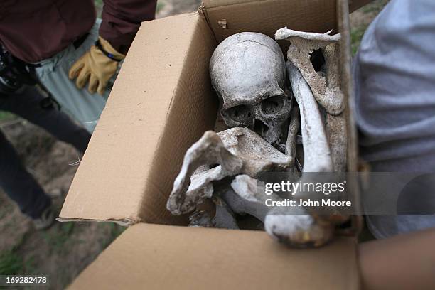 Anthropology students collect bones from a suspected undocumented immigrant scattered on a ranch and found by the U.S. Border Patrol on May 22, 2013...