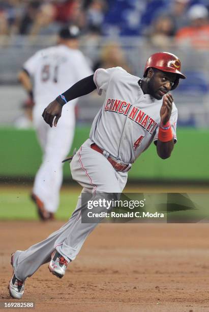 Brandon Phillips of the Cincinnati Reds rounds third base during a MLB game against the Miami Marlins at Marlins Park on May 15, 2013 in Miami,...
