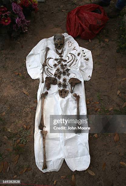 Skeleton of a suspected undocumented immigrant lies partially reassembled after it was exhumed from a gravesite on May 22, 2013 in Falfurrias, Brooks...