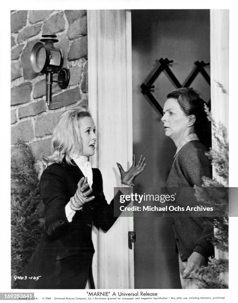 Tippi Hedren makes her way to the farm house of Meg Wyllie to ask for a gun in a scene from the film 'Marnie', 1964.