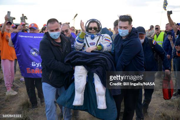 Expedition 69 Roscosmos cosmonaut Dmitri Petelin is carried to a medical tent shortly after he, NASA astronaut Frank Rubio, and Roscosmos cosmonaut...