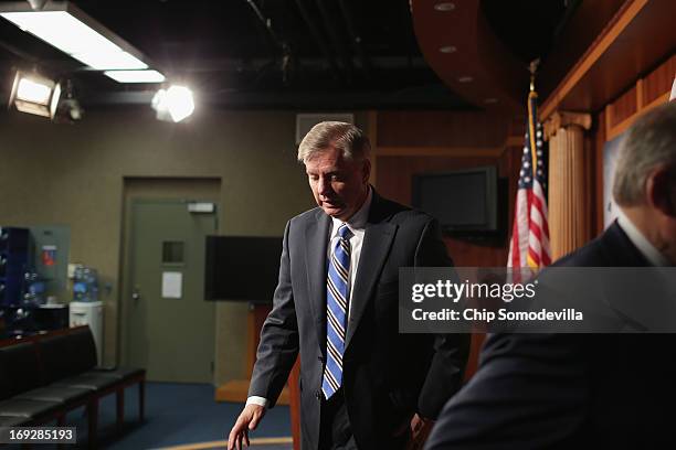 Sen. Lindsey Graham leaves after a news conference after the senate voted 99-0 in favor of a resolution in support of Israel May 22, 2013 in...