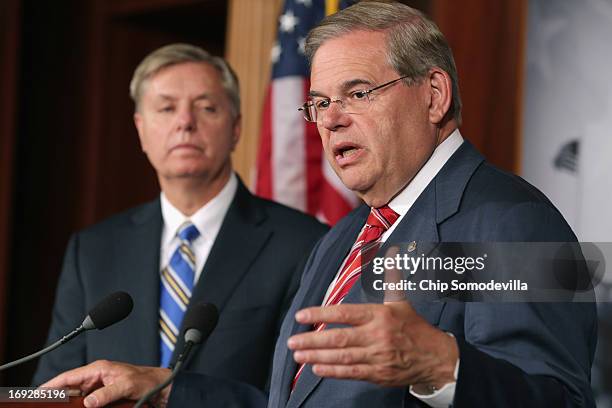 Senate Foreign Relations Committee Chairman Robert Menendez and U.S. Sen. Lindsey Graham hold a news conference after the senate voted 99-0 in favor...