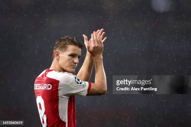 Martin Odegaard of Arsenal applauds fans during the UEFA Champions League match between Arsenal FC and PSV Eindhoven at Emirates Stadium on September...