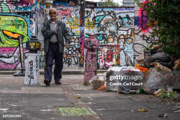 Rubbish is piled in a street off Brick Lane during an ongoing strike by Tower Hamlets refuse collectors, on September 27, 2023 in London, England.