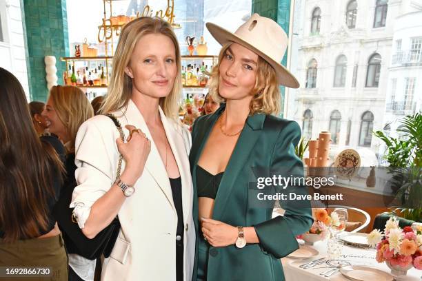 Candice Lake and Arizona Muse attend the launch of the Breitling Navitimer 32/36 Collection and 'For The Journey' campaign hosted by Breitling and...