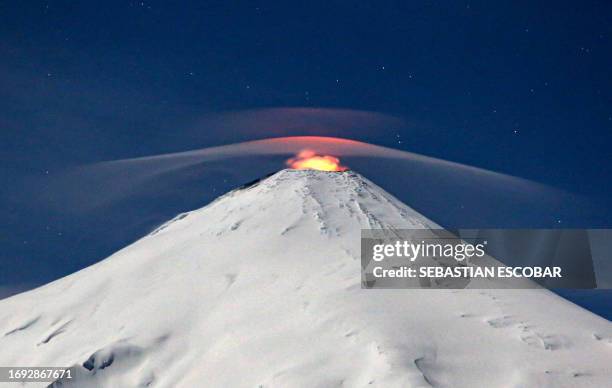 View of the Villarrica volcano as seen from Villarrica, some 800 kilometres south of Santiago, Chile, on September 27, 2023. Villarrica is among the...