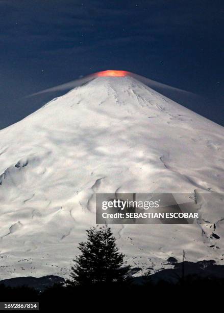 View of the Villarrica volcano as seen from Villarrica, some 800 kilometres south of Santiago, Chile, on September 27, 2023. Villarrica is among the...