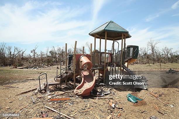 Debris litters a playground after a tornado ripped through the area on May 22, 2013 in Moore, Oklahoma. The tornado of at least EF4 strength and two...