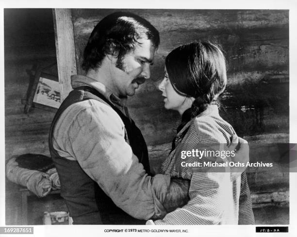 Burt Reynolds holding Sarah Miles in a scene from the film 'The Man Who Loved Cat Dancing', 1973.