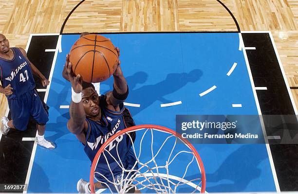 Larry Hughes of the Washington Wizards goes up for the dunk during the NBA game against the Orlando Magic at TD Waterhouse Centre on December 6, 2002...