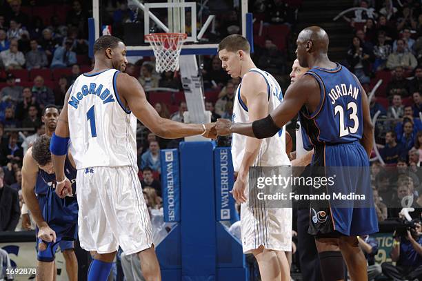 Michael Jordan of the Washington Wizards greets Tracy McGrady of the Orlando Magic during the NBA game at TD Waterhouse Centre on December 6, 2002 in...