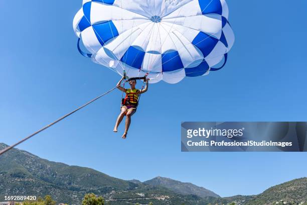 sky tales nearing their close - paragliding stock pictures, royalty-free photos & images