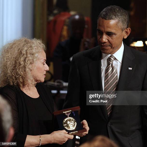 President Barack Obama awards singer-songwriter Carole King the 2013 Library of Congress Gershwin Prize for Popular Song during a concert at the...