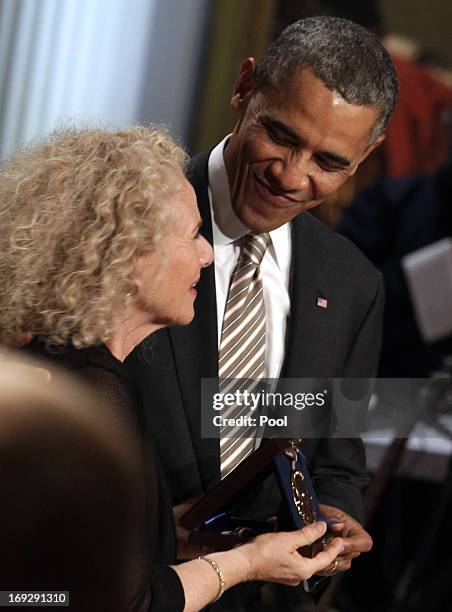 President Barack Obama awards singer-songwriter Carole King the 2013 Library of Congress Gershwin Prize for Popular Song during a concert at the...