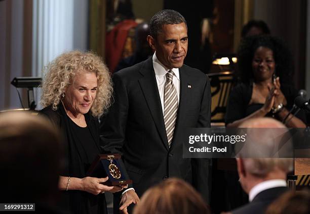 President Barack Obama awards singer-songwriter Carole King the 2013 Library of Congress Gershwin Prize for Popular Song during a concert at the...