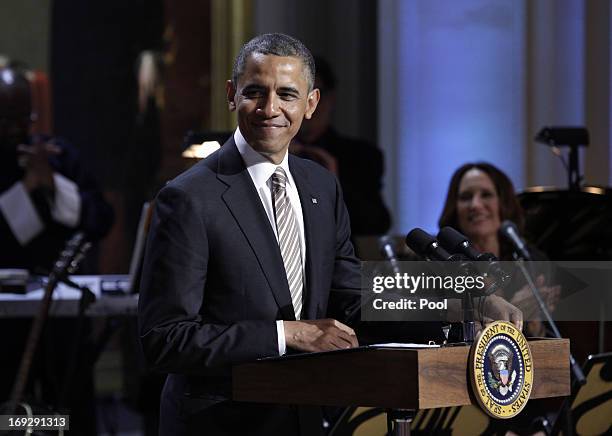 President Barack Obama delivers remarks at a concert honoring singer-songwriter Carole King with the 2013 Library of Congress Gershwin Prize for...