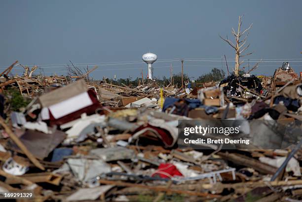 The Moore water tower stands in the distance May 22, 2013 in Moore, Oklahoma. The two-mile-wide Category 5 tornado touched down May 20 killing at...