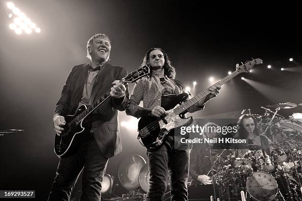 Rush From Alex Lifeson, Geddy Lee and Neil Peart of Rush perform on stage at ...