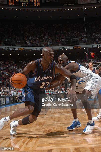 Michael Jordan of the Washington Wizards drives to the basket past Darrell Armstrong of the Orlando Magic during the NBA game at TD Waterhouse Centre...