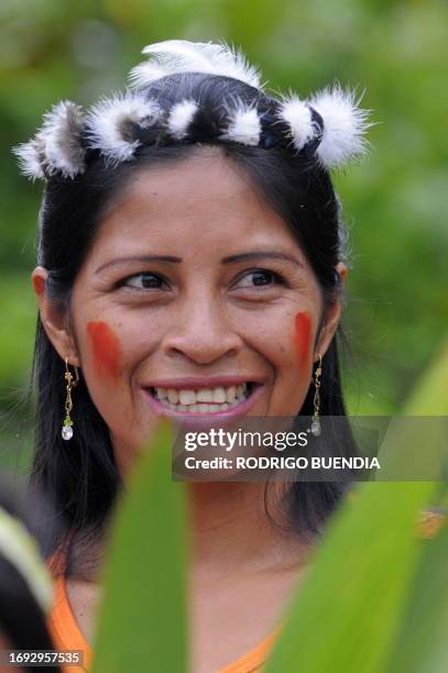 An Ecuadorean Waorani native smiles, at the Yasuni National Park, at the Ecuadorean Amazon forest, on August 21, 2010. AFP PHOTO / RODRIGO BUENDIA