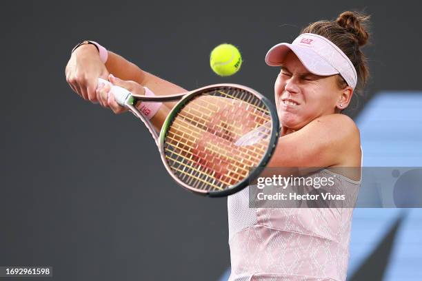 Veronika Kudermetova of Russia plays a backhand during the women's singles round of 16 match against Victoria Azarenka of Belarus as part of the day...