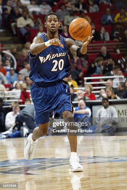 Larry Hughes of the Washington Wizards makes a pass during the NBA game against the Orlando Magic at TD Waterhouse Centre on December 6, 2002 in...