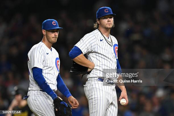 Starting pitcher Justin Steele reacts before handing the game ball over to manager David Ross of the Chicago Cubs in the fourth inning against the...