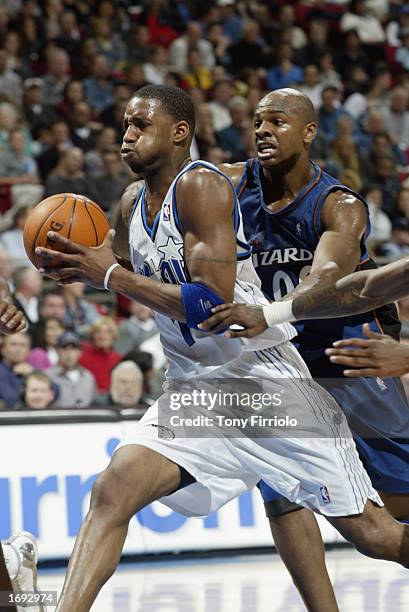 Tracy McGrady of the Orlando Magic drives to the basket during the NBA game against the Washington Wizards at TD Waterhouse Centre on December 6,...