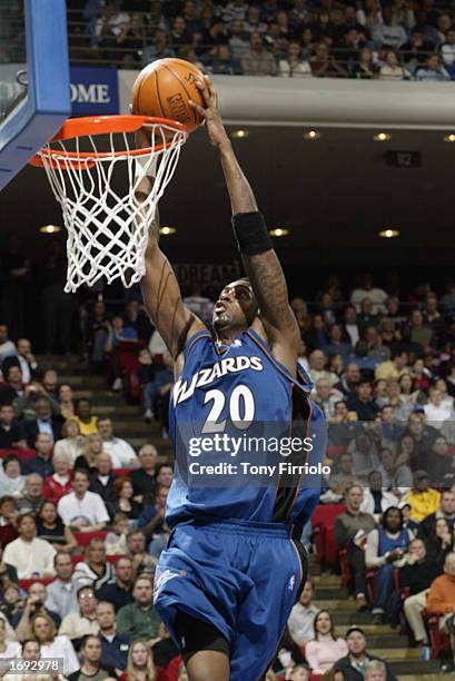 Larry Hughes of the Washington Wizards dunks during the NBA game against the Orlando Magic at TD Waterhouse Centre on December 6, 2002 in Orlando,...