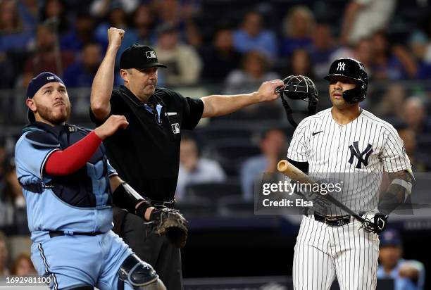 Gleyber Torres of the New York Yankees reacts after he is called out in the sixth inning as the foul tip was caught by Alejandro Kirk of the Toronto...