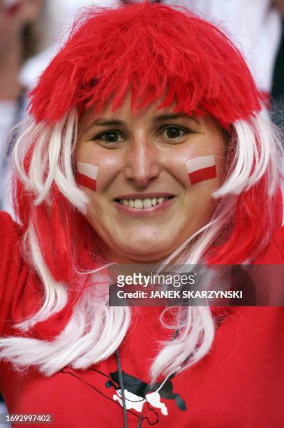 Polish supporter cheers her team prior to the Fifa World Cup 2006 group A football match Poland vs. Ecuador, 09 June 2006 at Gelsenkirchen stadium....