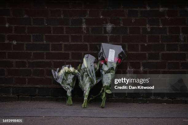 Flowers laid by wellwishers at the scene of a fatal stabbing of a fifteen year old girl, behind the Whitgift Shopping Centre on September 27, 2023 in...