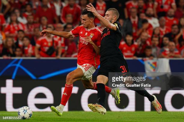 Petar Musa of SL Benfica with Strahinja Pavlovic of FC Salzburg in action during the Group D - UEFA Champions League 2023/24 match between SL Benfica...