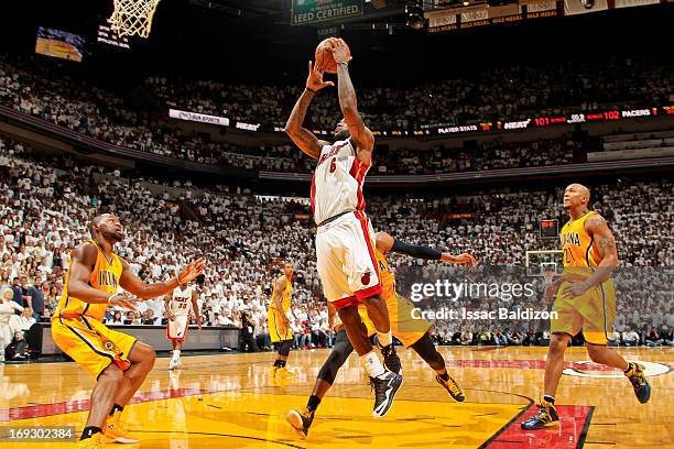 LeBron James of the Miami Heat makes the game winning layup in overtime against the Indiana Pacers in Game One of the Eastern Conference Finals...