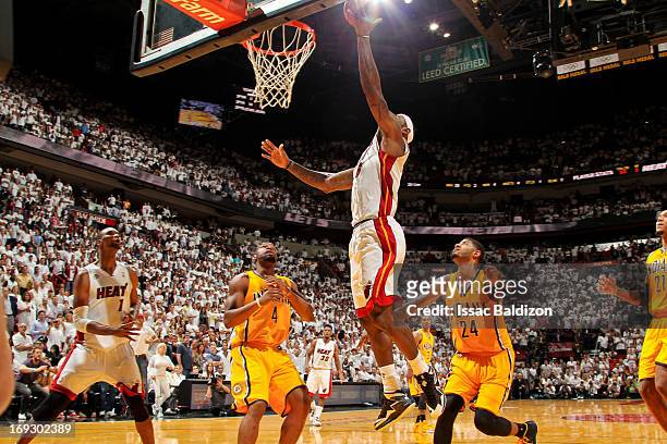 LeBron James of the Miami Heat makes the game winning layup in overtime against the Indiana Pacers in Game One of the Eastern Conference Finals...