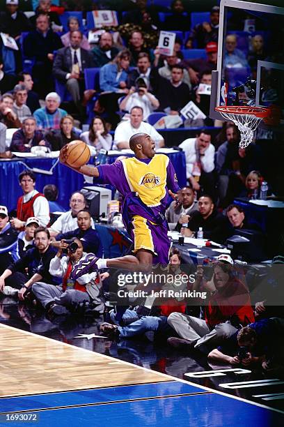 Kobe Bryant of the Los Angeles Lakers goes up for one of his slam dunks that won first place in the NBA All-Star Slam Dunk Contest at Gund Arena on...