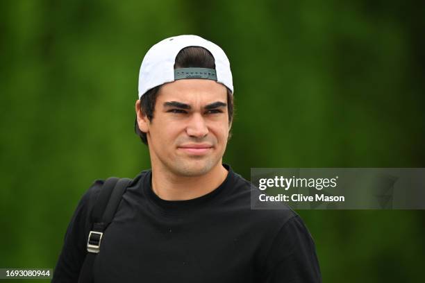 Lance Stroll of Canada and Aston Martin F1 Team walks in the Paddock during previews ahead of the F1 Grand Prix of Japan at Suzuka International...