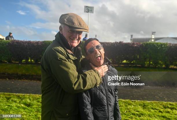 Meath , Ireland - 27 September 2023; Captain Frankie Dettori, right, celebrates winning the cup alongside losing captain Willie Mullins after the...