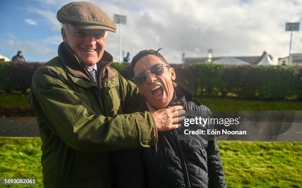 Meath , Ireland - 27 September 2023; Captain Frankie Dettori, right, celebrates winning the cup alongside losing captain Willie Mullins after the...