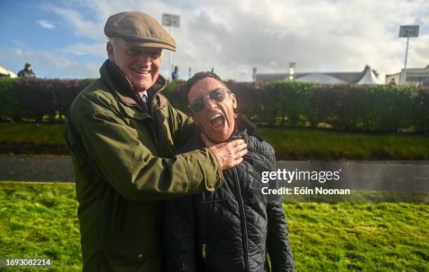 Meath , Ireland - 27 September 2023; Captain Frankie Dettori, right, celebrates winning the cup alongside losing captain Willie Mullins after the...