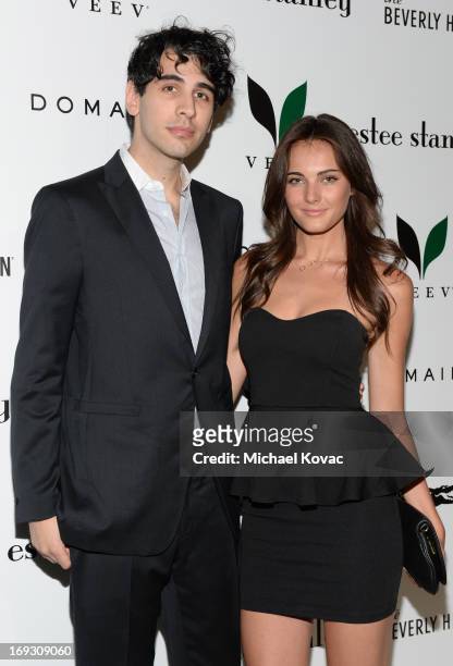 Nick Simmons and guest attend The Beverly Hilton unveiling of the redesigned Aqua Star Pool By Estee Stanley at The Beverly Hilton Hotel on May 22,...