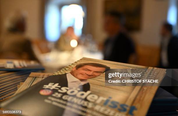 Brochure with recipes and a photo of Germany's Christian Social Union party leader and top candidate, Bavarian State Premier Markus Soeder is...