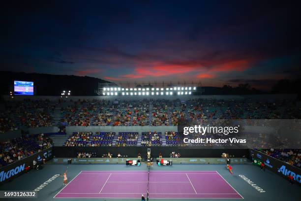 General view at sunset as Veronika Kudermetova of Russia serves during the women's singles round of 16 match against Victoria Azarenka of Belarus as...