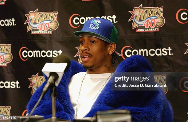 Guard Allen Iverson of the Philadelphia 76ers speaks at the post game press conference wearing a Seattle Seahawks cap after the 76ers defeated the...