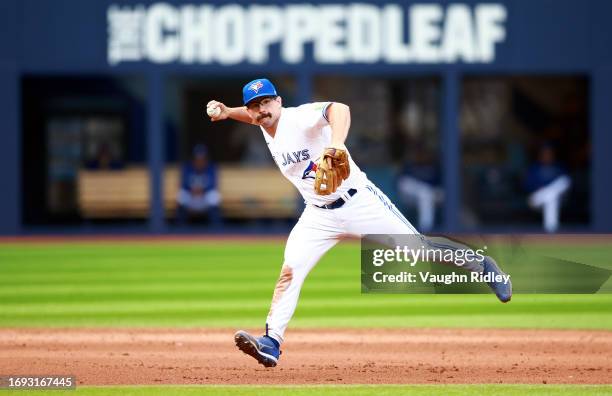 Davis Schneider of the Toronto Blue Jays throws to first base against the Kansas City Royals at Rogers Centre on September 10, 2023 in Toronto,...